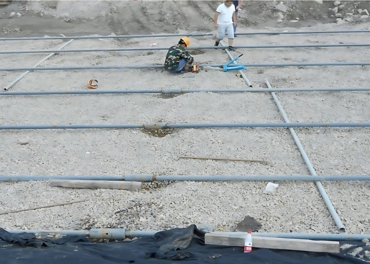 Steel tie rod construction project: Engineers assembling steel tie rod system on site