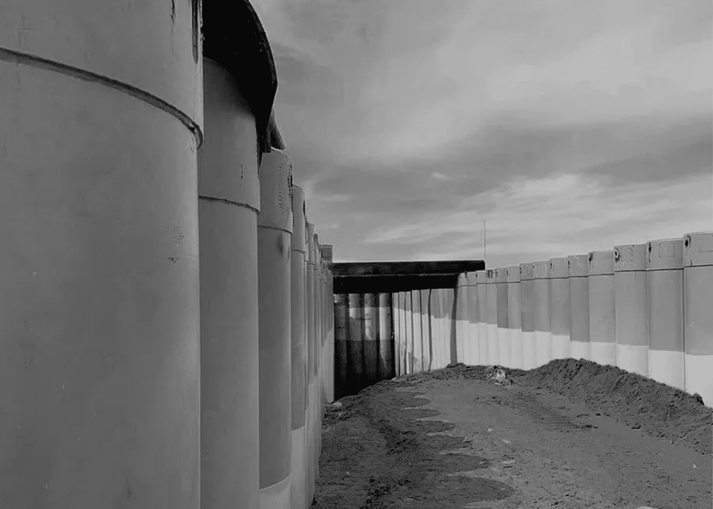 Image representing the versatility in application for different pipe types: Large-diameter steel piles installed for quay wall construction in marine engineering projects.